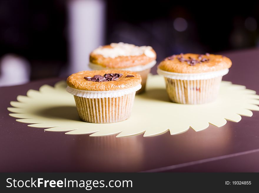 Fresh chocolate chip muffins . Macro with shallow dof.