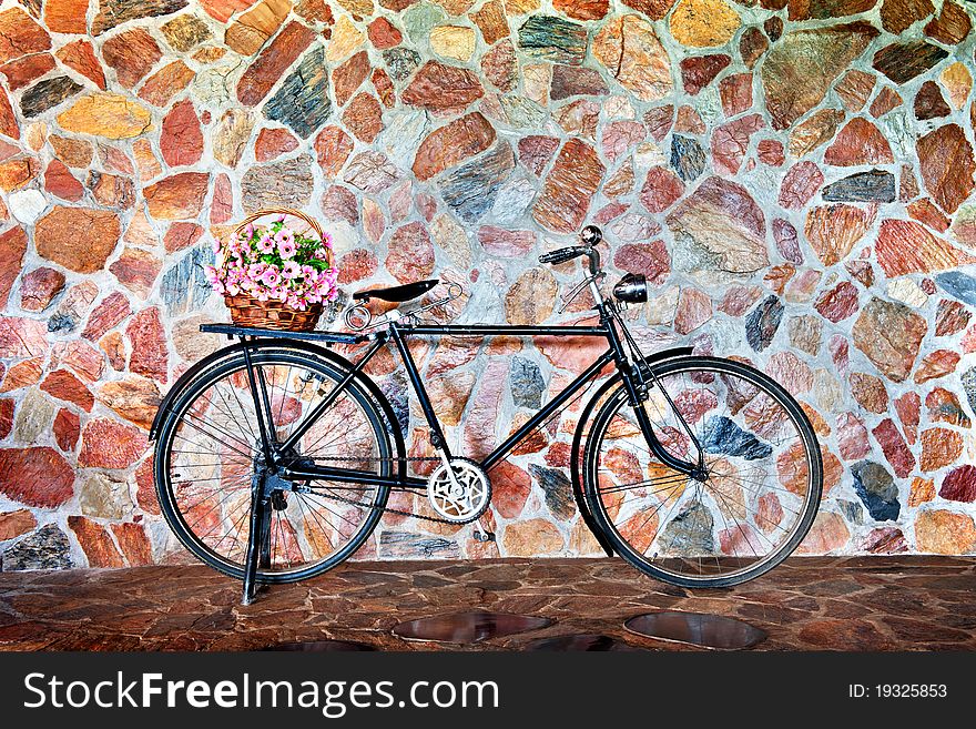 Vintage bicycle with basket of pink flowers. Vintage bicycle with basket of pink flowers