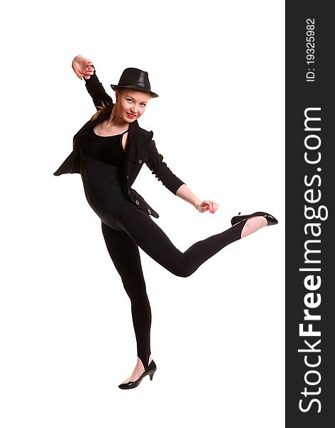 Young woman in black suit and hat dancing. Young woman in black suit and hat dancing.