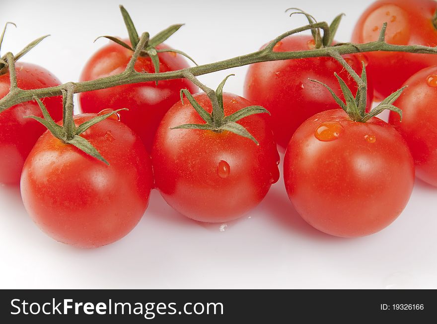 Red tomatoes on a white background