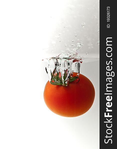 Red tomatoes on a white background