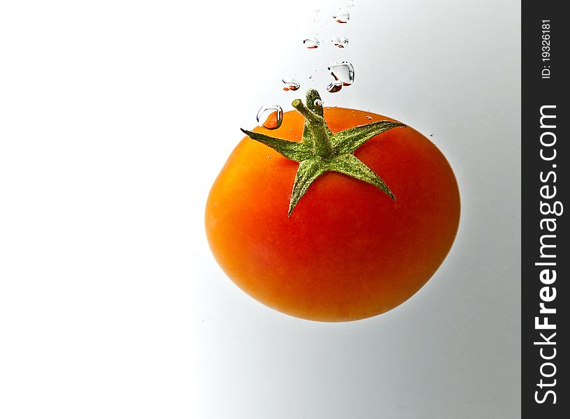 Red tomatoes on a white background