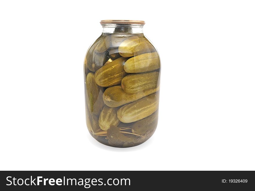 Canned cucumber in a glass jar. Pickles.