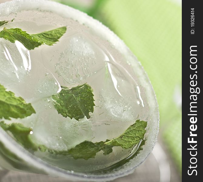 Photo of glass of mojito done in close up in studio. Photo of glass of mojito done in close up in studio
