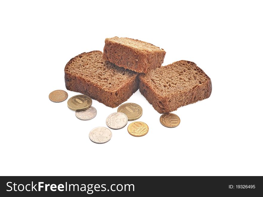 A piece of bread and a coin. Bread on a white background.