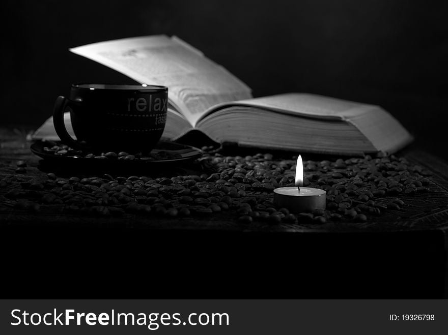 Background decoration with candle in focus and coffee on book. Background decoration with candle in focus and coffee on book