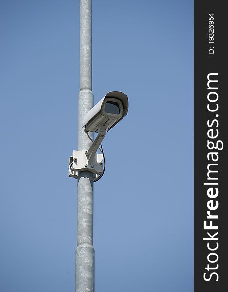 Surveillance camera on a pole. Surveillance camera on a pole