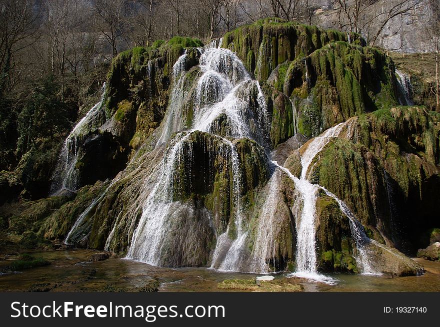 Magnific green mossy waterfall in canyon. Cirque Baume, France, Europe. Magnific green mossy waterfall in canyon. Cirque Baume, France, Europe