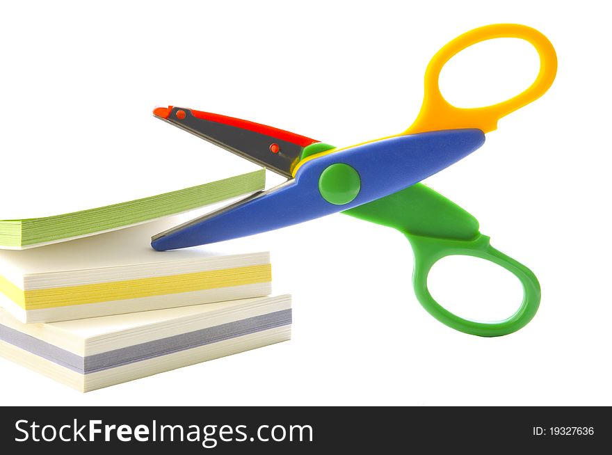 Scissors and paper on the white isolated background