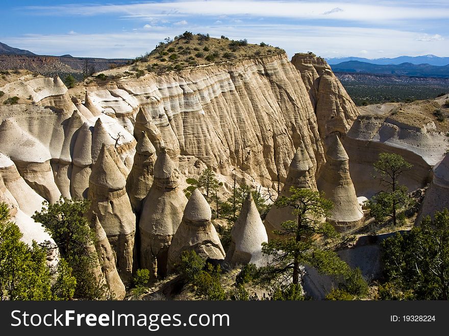 Desert mountains and spire with blue skies. Desert mountains and spire with blue skies.