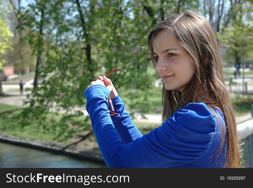 Teenage model in Poland wearing casual dress, smiling gently. Close portrait. Teenage model in Poland wearing casual dress, smiling gently. Close portrait.