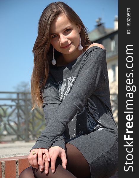 Sitting on stairs - young girl