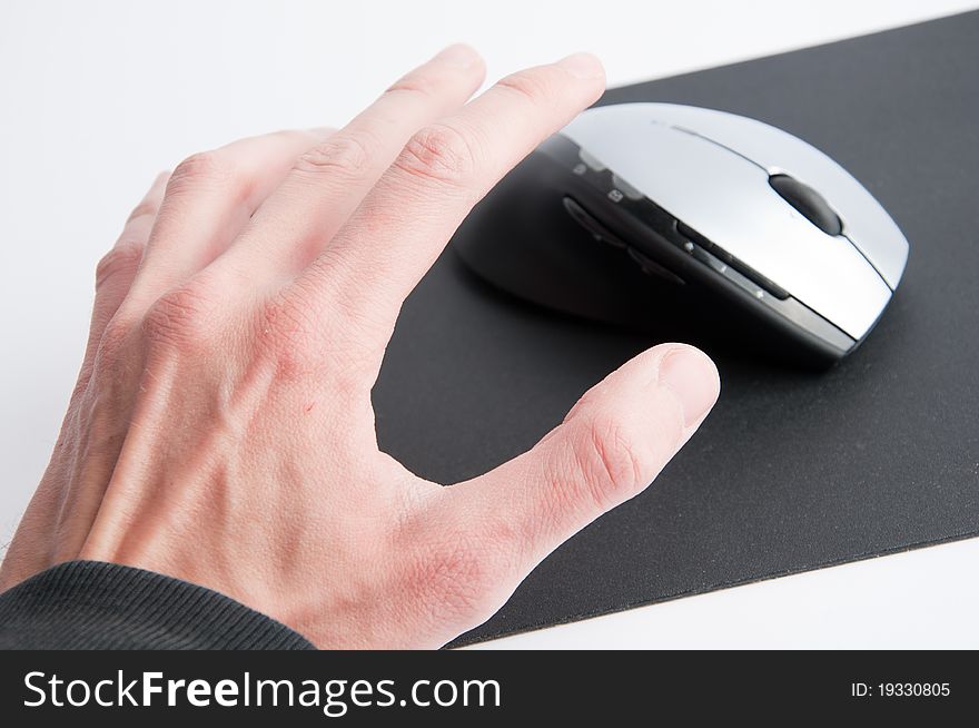 Man hand catching left hand computer mouse. Man hand catching left hand computer mouse