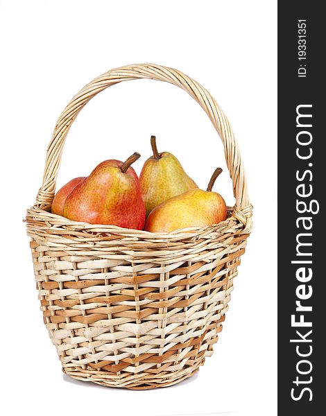 Basket with pears different pears on a white background