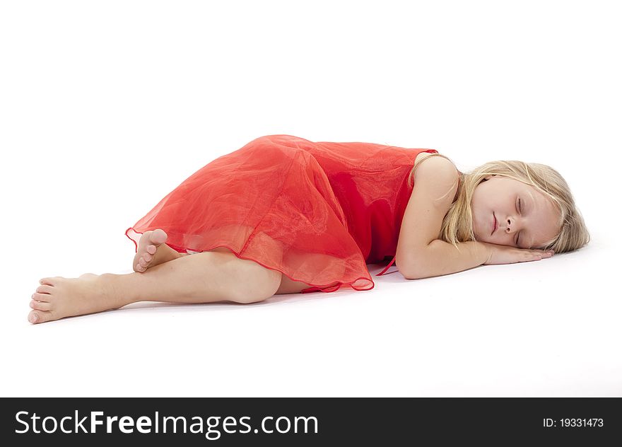 Little girl sleeping in a red dress on a white background. Little girl sleeping in a red dress on a white background.