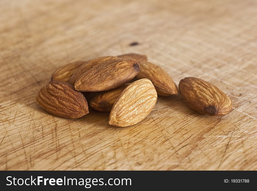 Almond nuts on wooden background. Almond nuts on wooden background