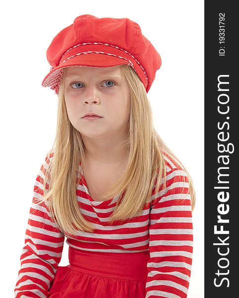 Little girl in red hat and dress looking worried and unhappy. On white background. Little girl in red hat and dress looking worried and unhappy. On white background.