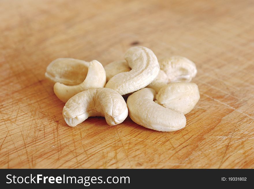 Cashew nuts on wooden background. Cashew nuts on wooden background