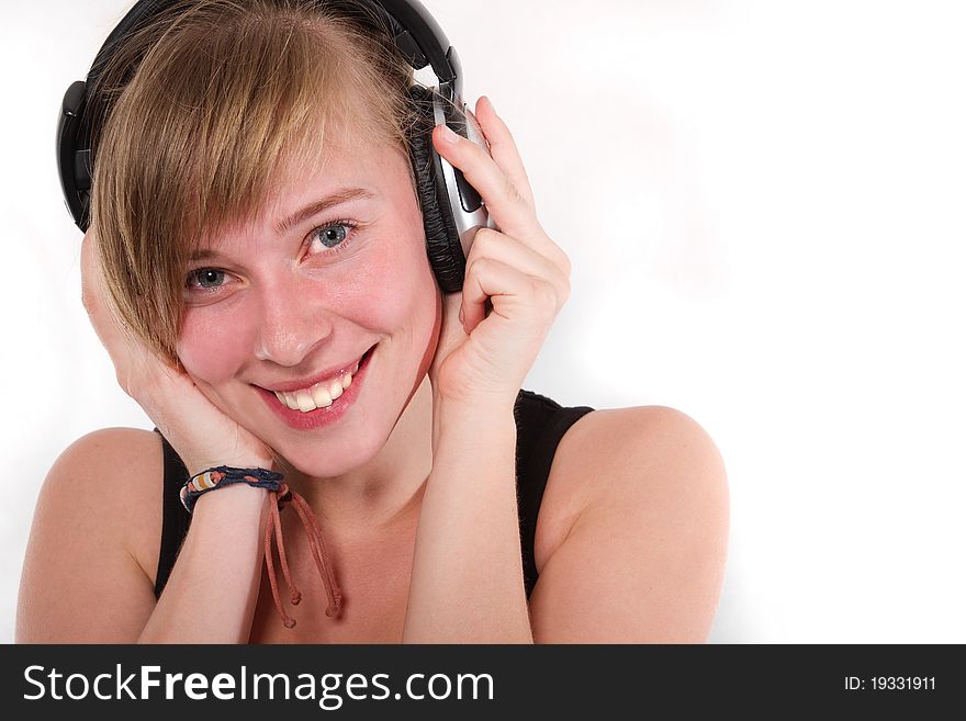 Young girl in DJ stereo headset smiling. Young girl in DJ stereo headset smiling