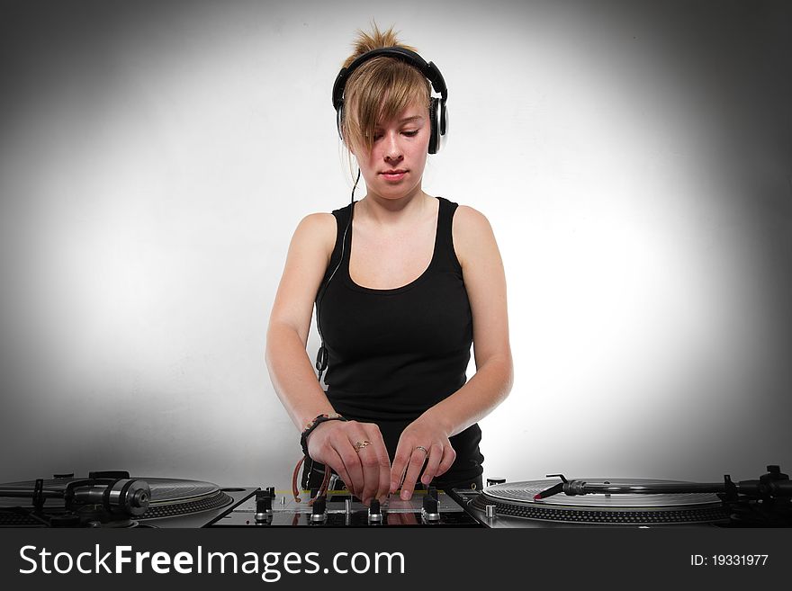 Late teenager chick playing hip-hop from vinyl records. Late teenager chick playing hip-hop from vinyl records