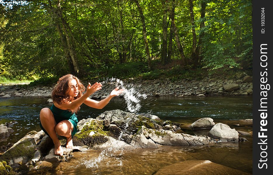 Young  woman playing with water