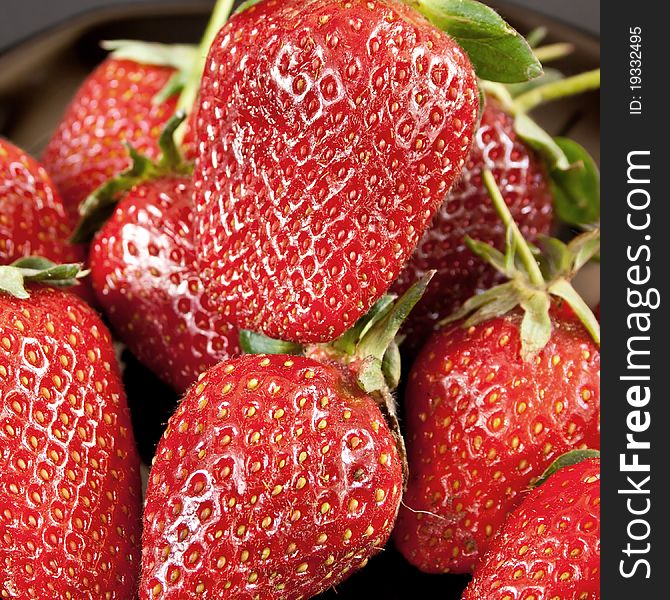 Fresh strawberries close up background. Fresh strawberries close up background