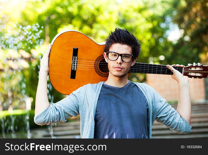 Young man playing a guitar. Young man playing a guitar