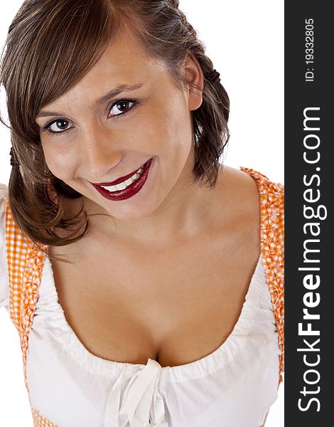 Young pretty woman with dirndl smiles in camera