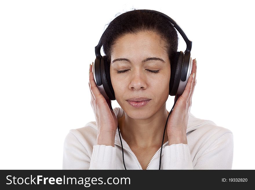 Portrait of a pretty woman listening music happily. Isolated on white background.