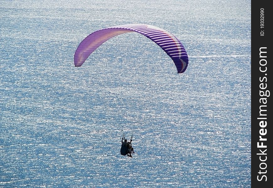 Paraplane flight over the sea. Educational flight on a paraglider. Paraplane flight over the sea. Educational flight on a paraglider.