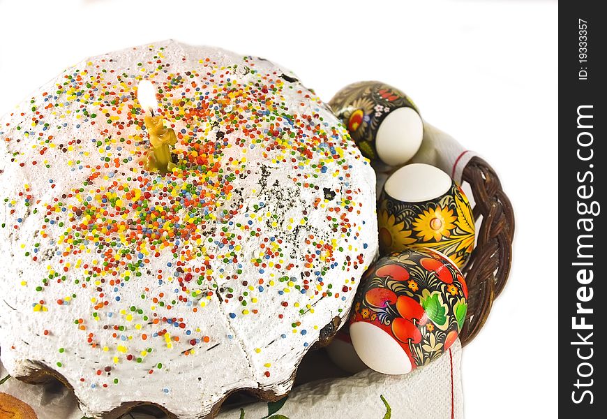 Easter cake with candle and eggs isolated on a white background. Easter celebrating. Easter cake with candle and eggs isolated on a white background. Easter celebrating.