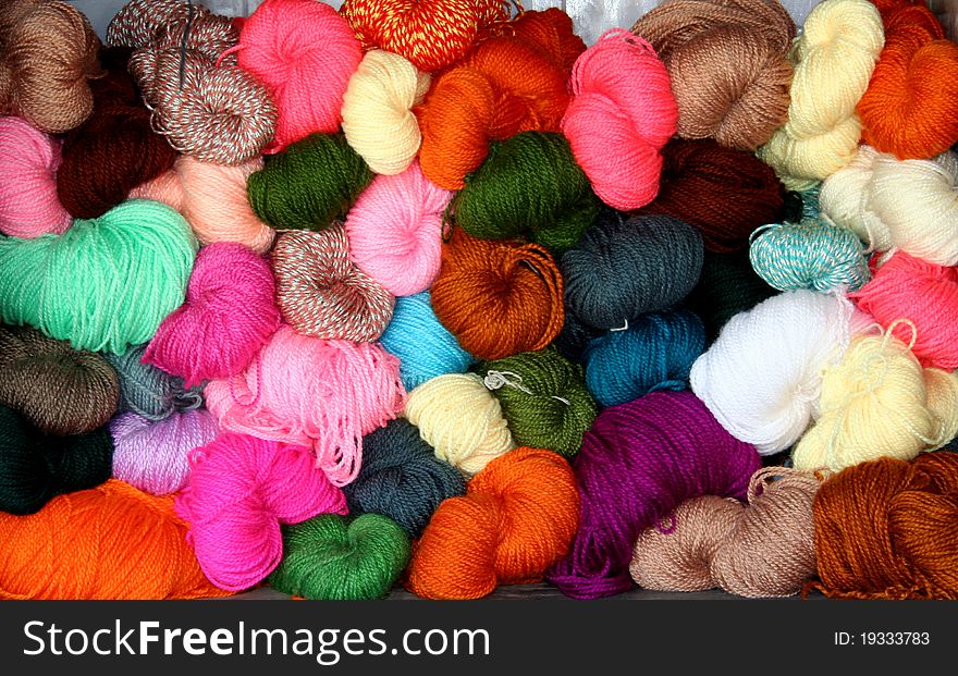 Colourful woollen balls used to create winter wear. Colourful woollen balls used to create winter wear
