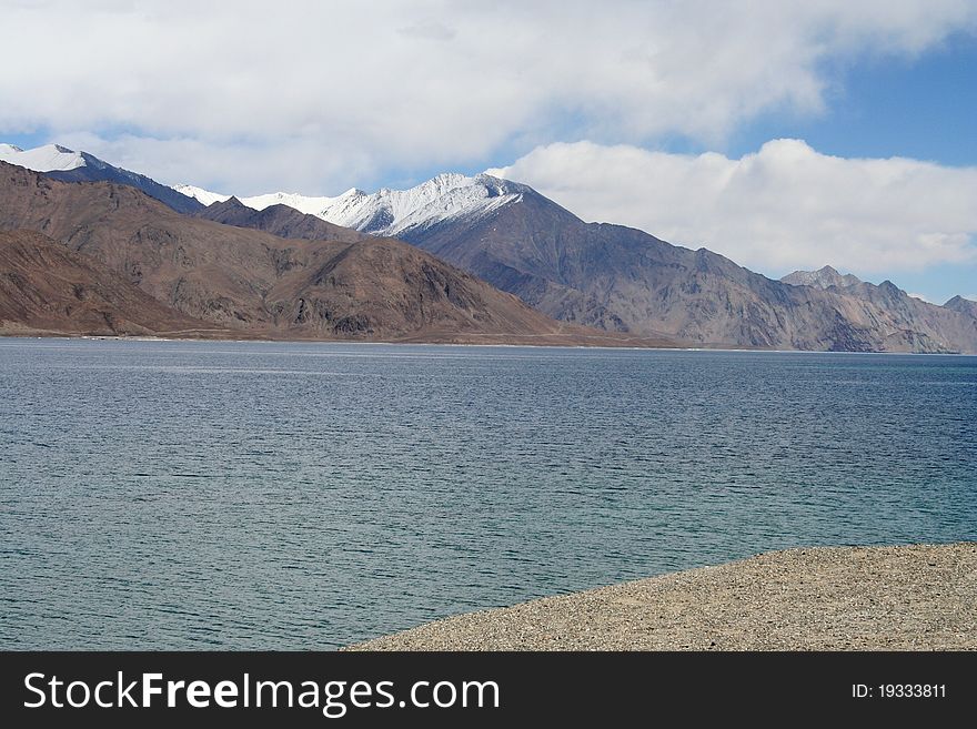 Beautiful serene blue lake in front of Snow clad mountains. Beautiful serene blue lake in front of Snow clad mountains