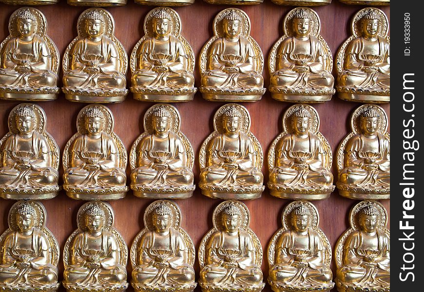 Many small Buddha statue on the wall at chinese temple in Thailand. Many small Buddha statue on the wall at chinese temple in Thailand