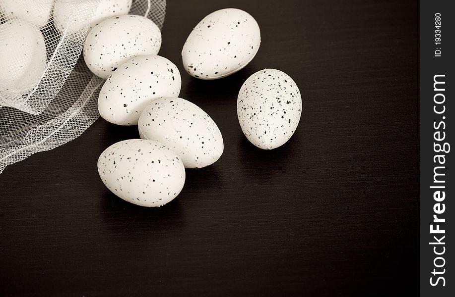 Quail eggs with black background