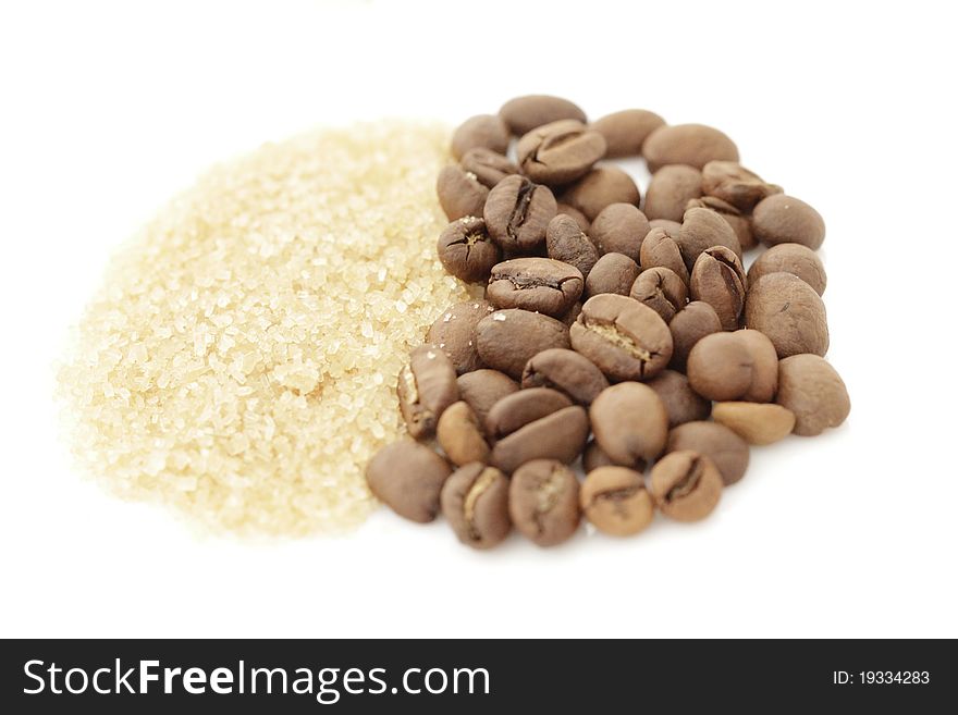 Sugar and coffee beans isolated on a white background. Sugar and coffee beans isolated on a white background
