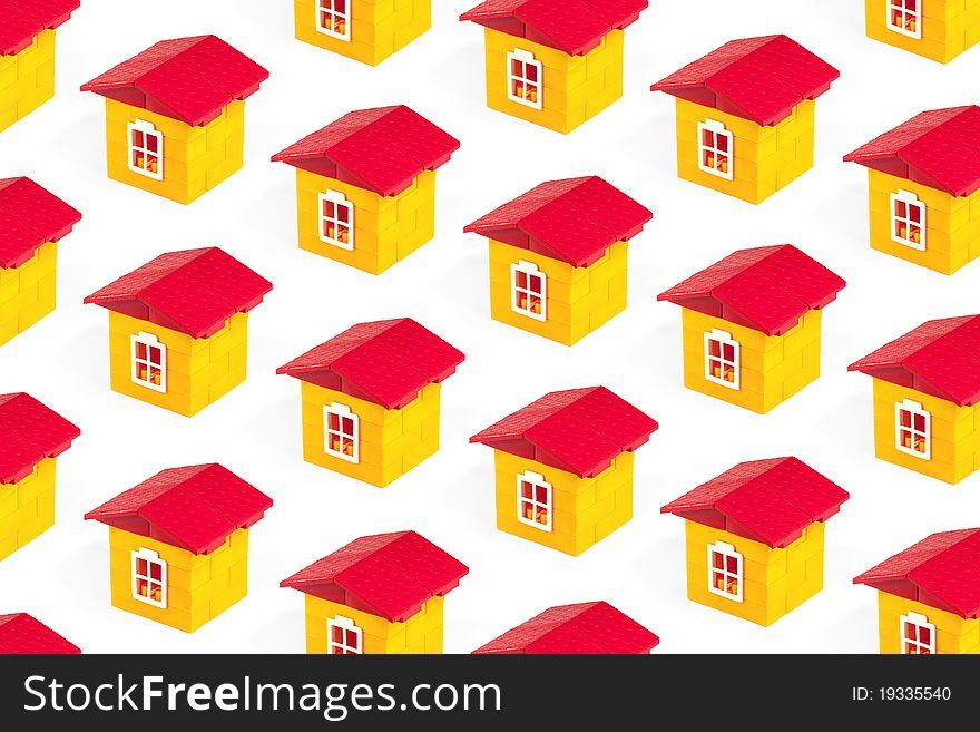 Toy houses lined up in rows on a white background. Concept, texture. Toy houses lined up in rows on a white background. Concept, texture
