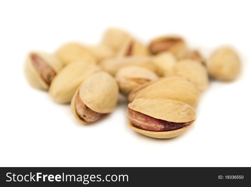 Pistachio nuts, isolated on white, close up