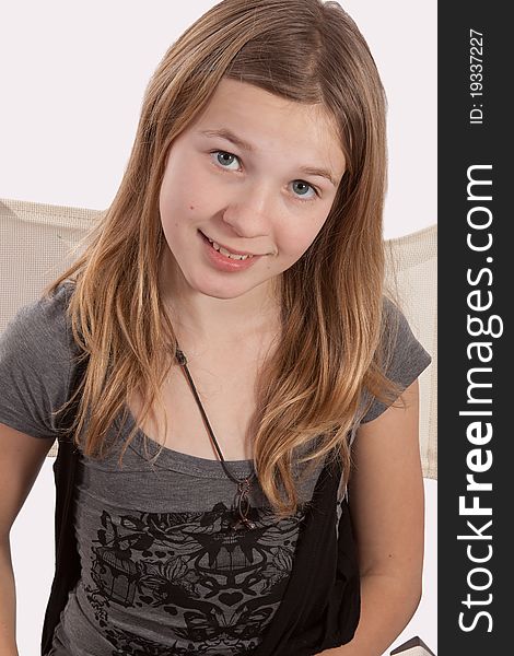 Portrait of cute eleven year old blond hair blue eyes caucasian girl smiling. Portrait of cute eleven year old blond hair blue eyes caucasian girl smiling