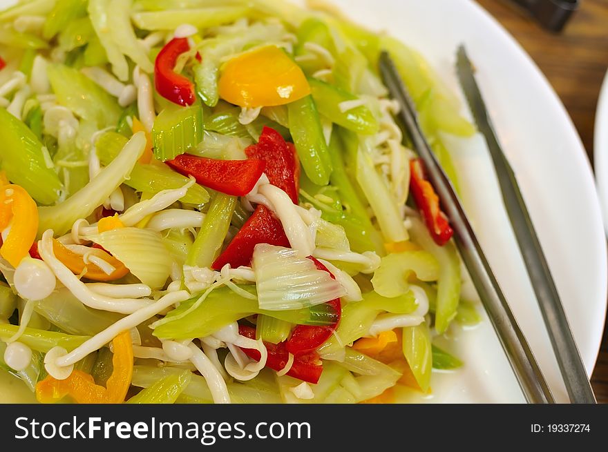 Green vegetables stir fried with golden mushrooms. Green vegetables stir fried with golden mushrooms.