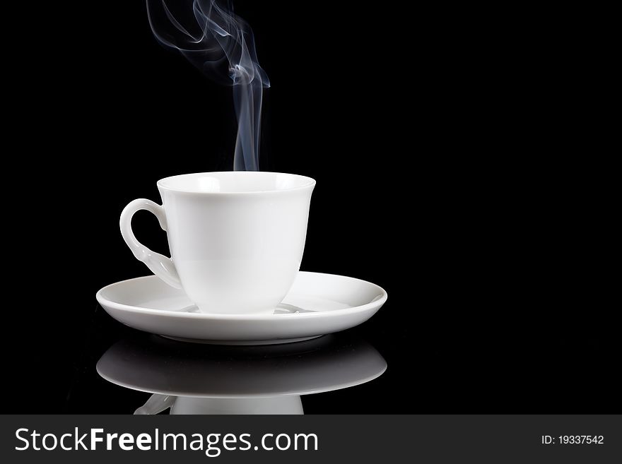 Hot coffee cup with reflection on black background