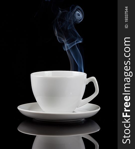 Hot coffee cup with reflection on black background