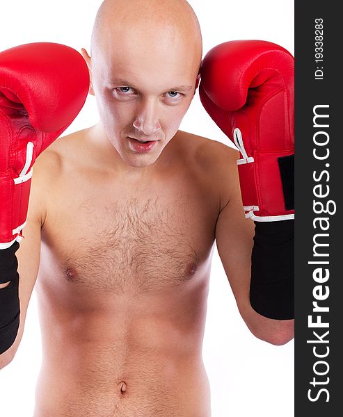 Young man wearing red boxing gloves. Young man wearing red boxing gloves