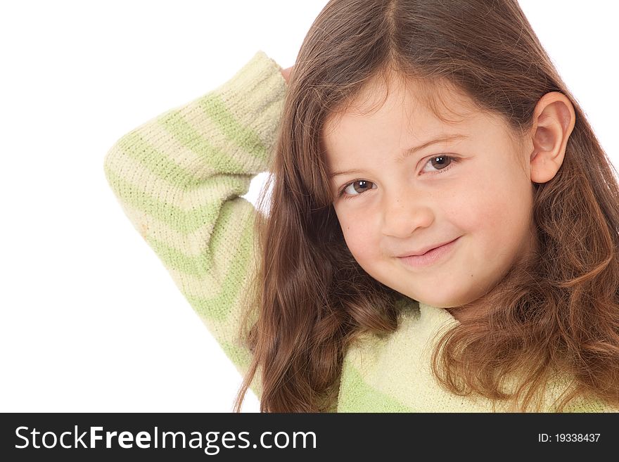 Young girl in green striped jumper jersey with arm behind head and smiling. Young girl in green striped jumper jersey with arm behind head and smiling