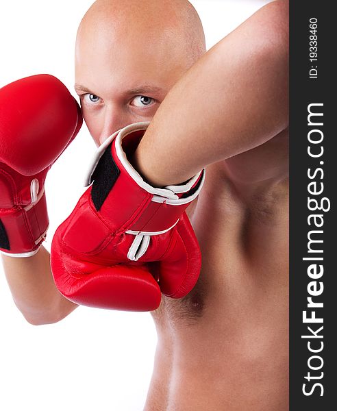 Bold boxer wearing red gloves and fightening. Bold boxer wearing red gloves and fightening