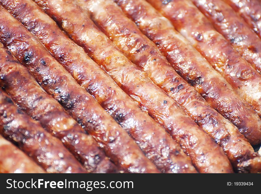 Fresh grilled sausages texture or background. Fresh grilled sausages texture or background