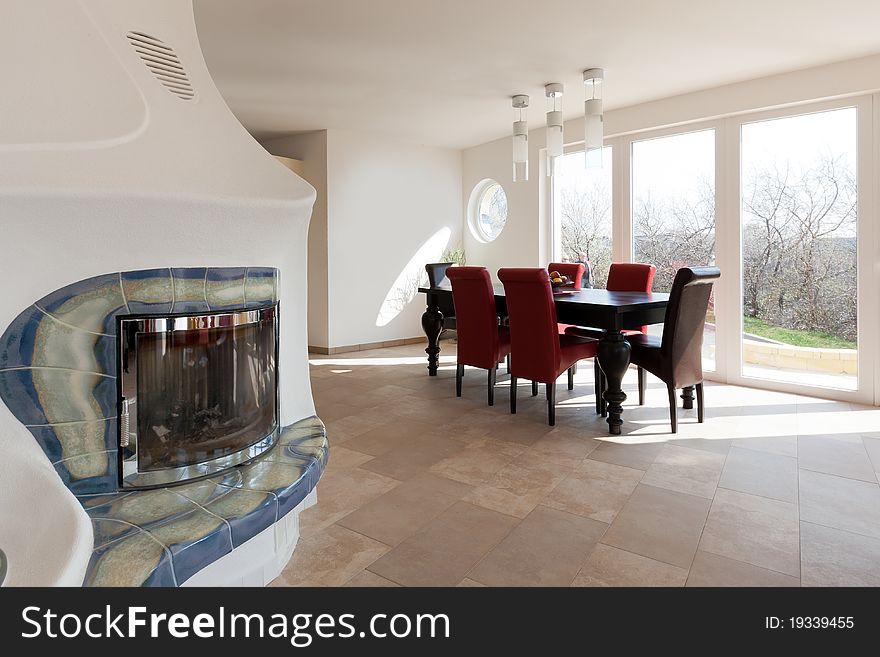 Interior with chimney, bright room and modern architecture