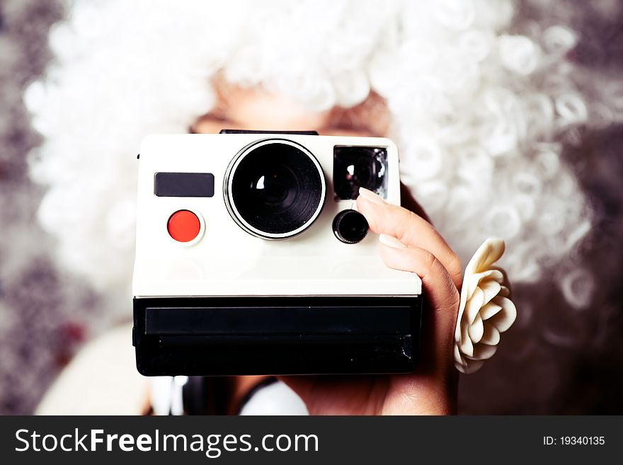Young girl holding a camera. Young girl holding a camera.