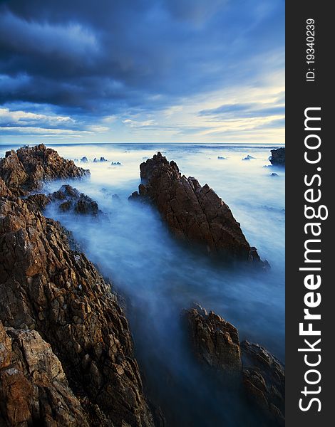 A long exposure showing the motion of the clouds and ocean over an extended period of time. A long exposure showing the motion of the clouds and ocean over an extended period of time.