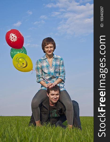 Young love Couple smiling with baloons